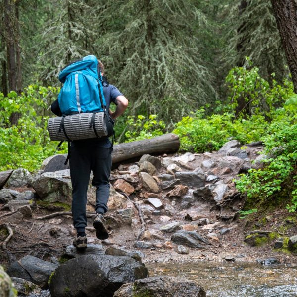 Man Walking on Rocky Terrain